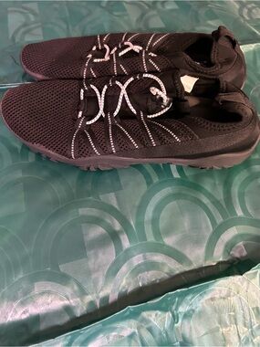 Black Knit Slip-On Athletic Shoe with White Contrast Laces